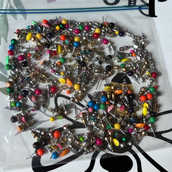 Bag full of different colored stud earrings. - Picture 13 of 13
